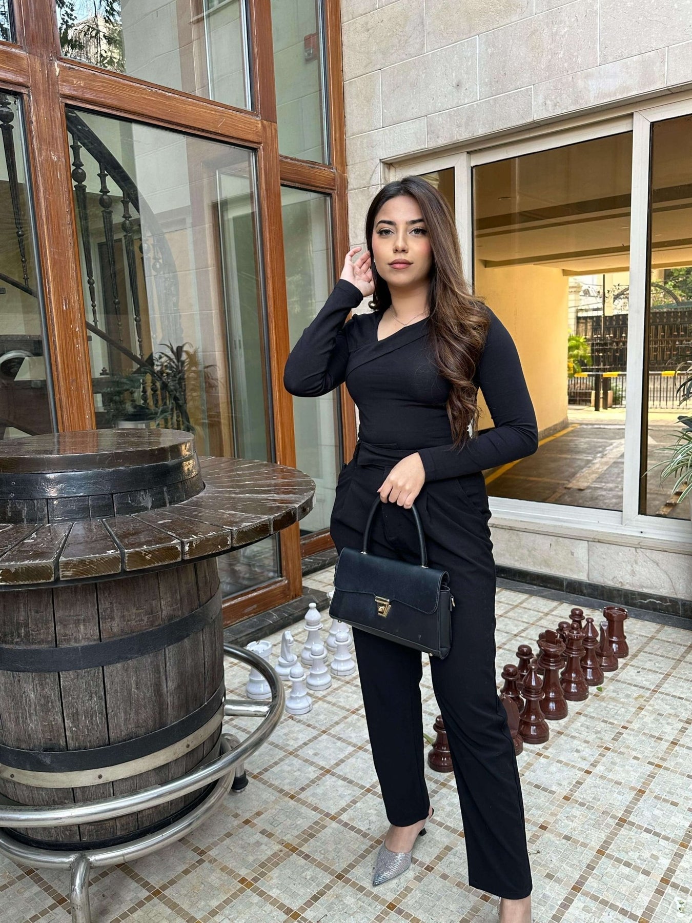Ladies’ black top handle bag with strap